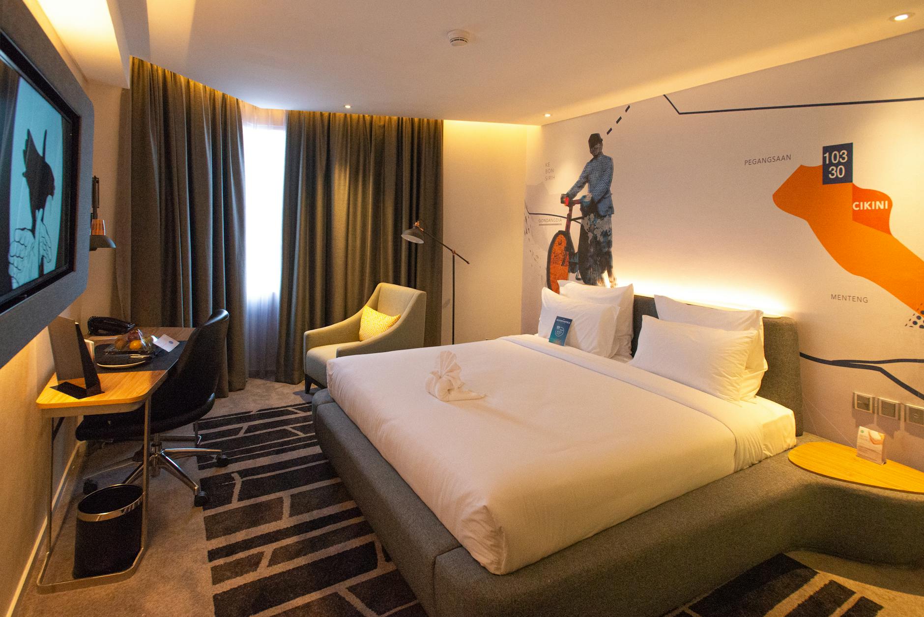 Boutique hotel room with unique design furniture and warm lighting