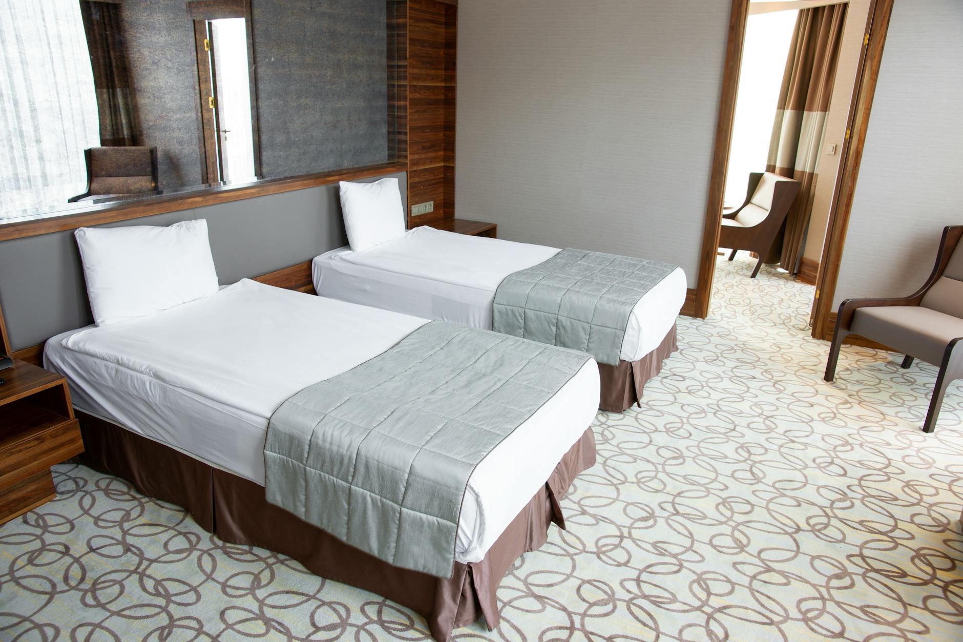 Spacious hotel family suite with two bedrooms and modern furnishings