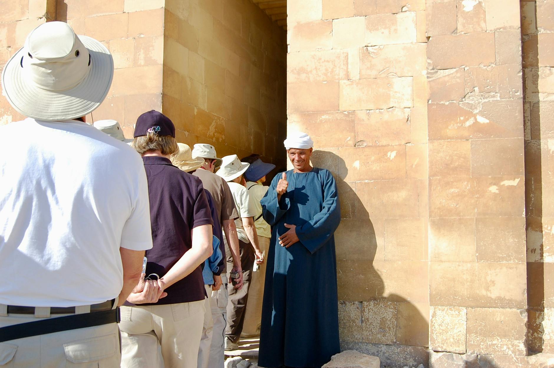 Tour guide showing visitors traditional Middle Eastern food at a Jerusalem market