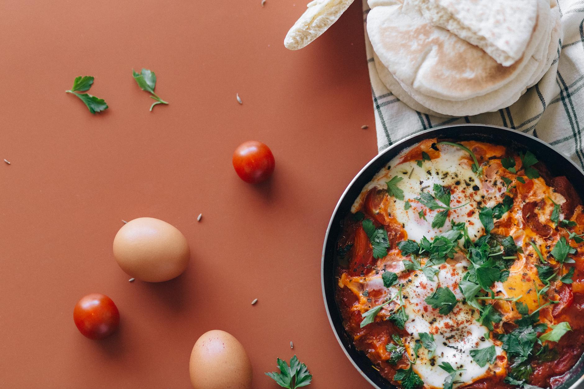 Traditional shakshouka with eggs poached in spiced tomato sauce