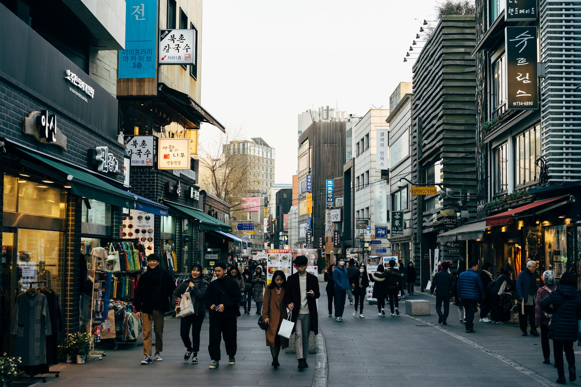Bustling Jerusalem city center pedestrian street with shops and outdoor dining