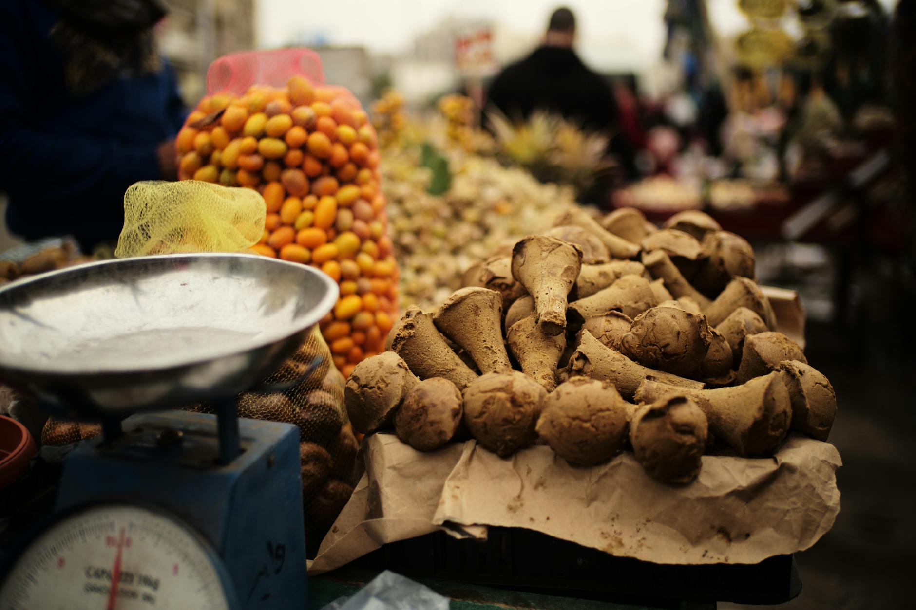Bustling Mahane Yehuda Market food stalls with fresh produce and vendors in Jerusalem