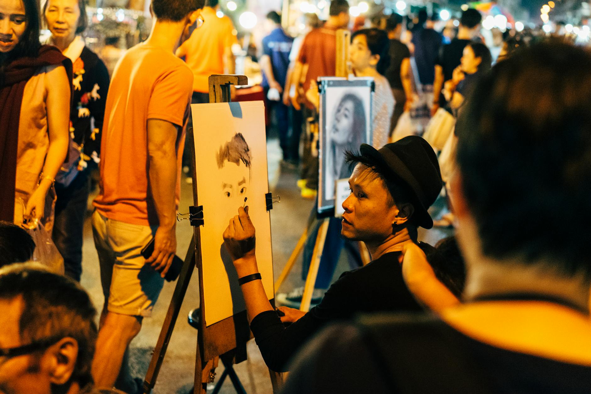 Mahane Yehuda Market in Jerusalem at night with bars, lights and street art on shutters