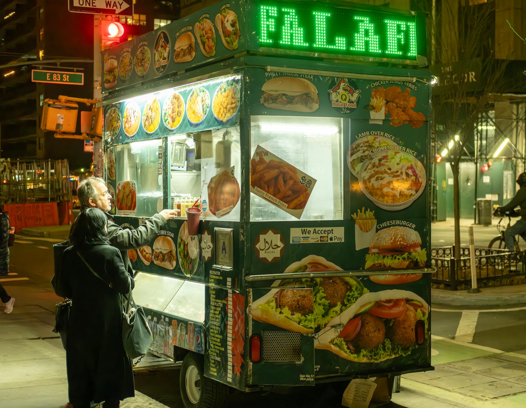 Late night Israeli street food and falafel stand in Jerusalem with warm lighting
