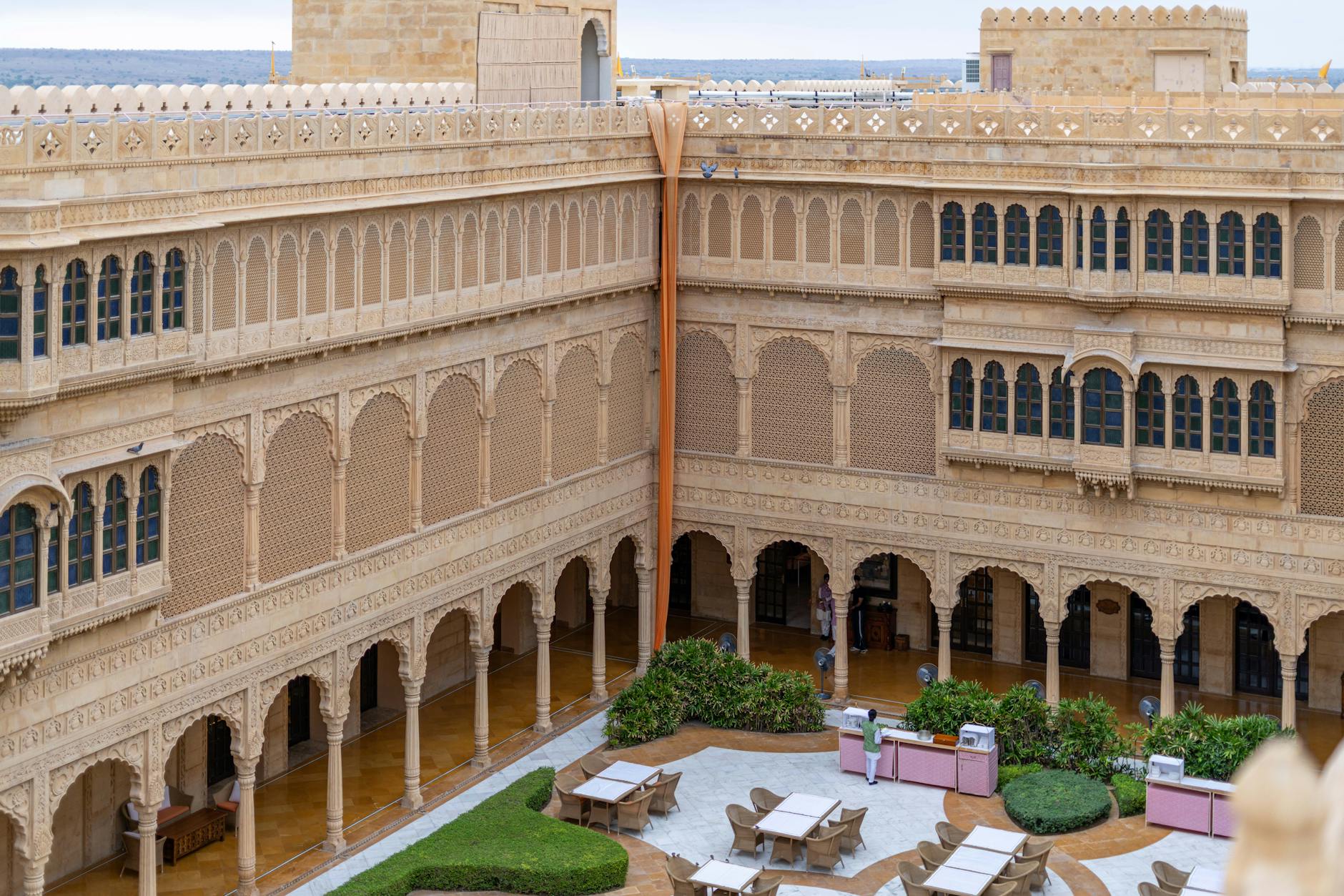 Stone-walled hotel courtyard inside Jerusalem Old City with arched windows and historic atmosphere