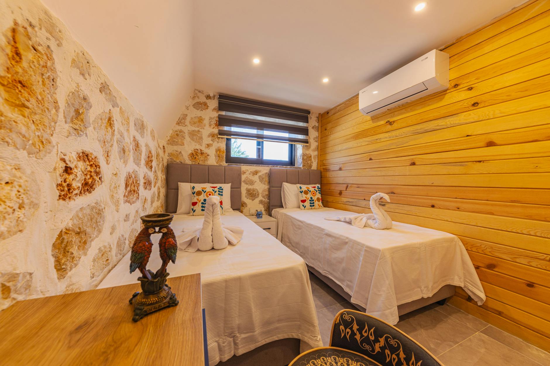 Comfortable hotel room in Jerusalem with traditional decor and stone wall details
