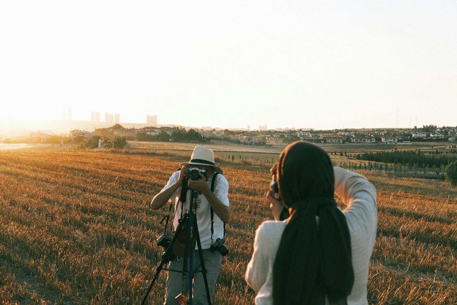 Camera and tripod set up at a Jerusalem viewpoint at golden hour with the city behind