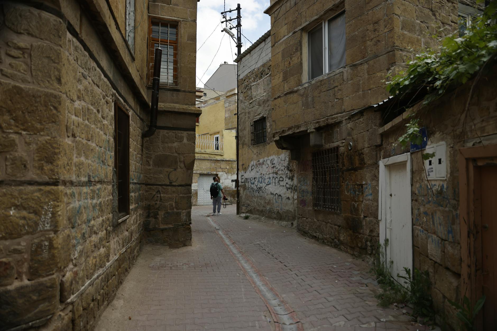 Walking through narrow stone alleyways in the Old City of Jerusalem on a self-guided tour