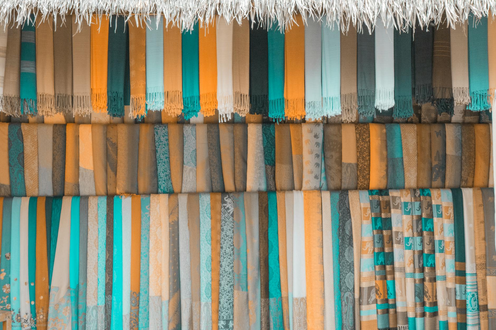 Colorful textiles and scarves hanging in Jerusalem Old City market shop