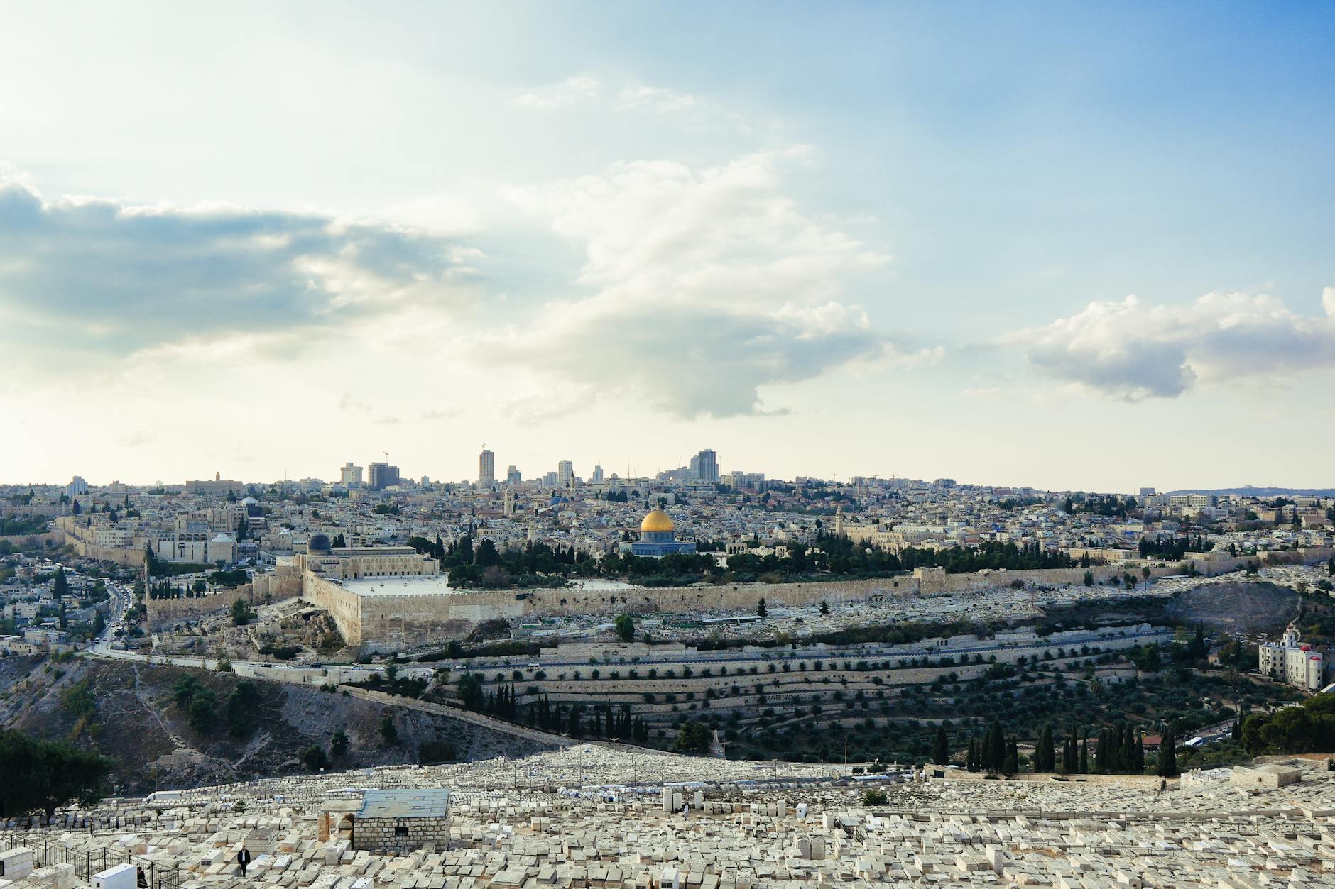 Sunset panorama of Jerusalem from a hilltop promenade with the Old City visible