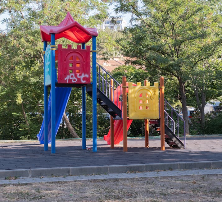 Children playing playground park family