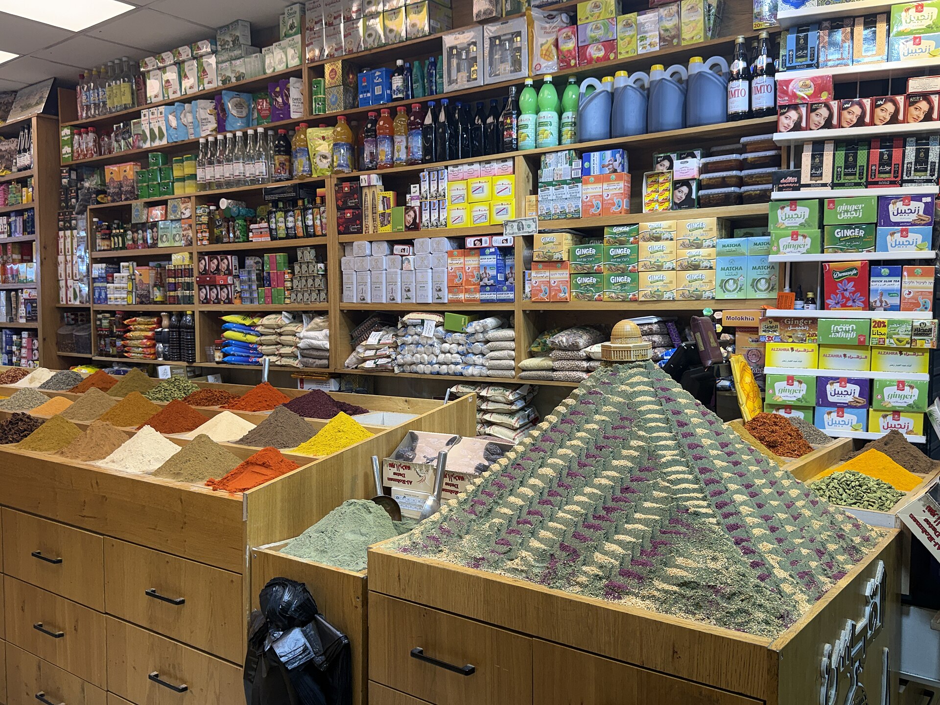 Cones of ground paprika, turmeric and other spices beside a za'atar pyramid topped with a Dome of the Rock model in a David Street spice shop in Jerusalem's Old City