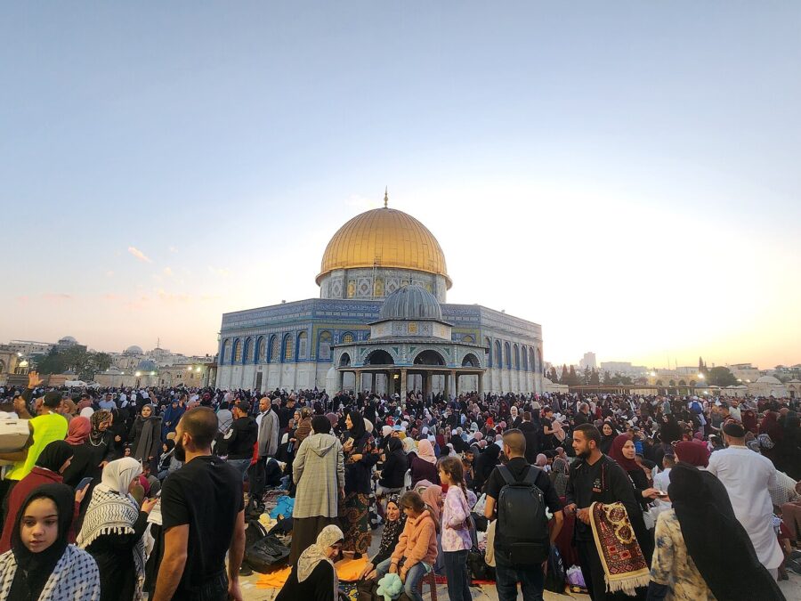 Crowds of Muslim families gathered on the Haram al-Sharif / Temple Mount esplanade in front of the Dome of the Rock at sunset during Ramadan