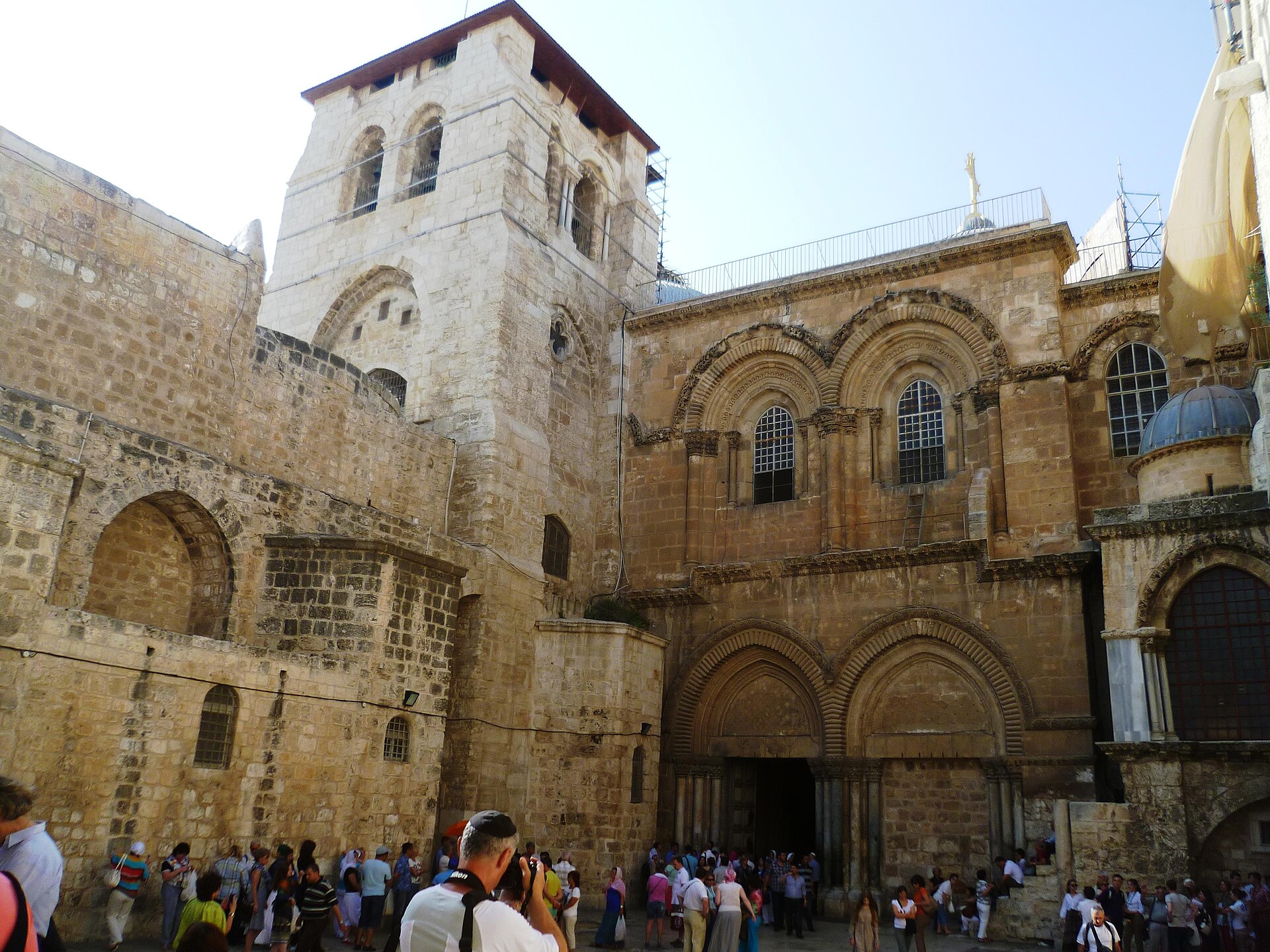 Crowds gathered in the stone courtyard outside the twin doorways of the Church of the Holy Sepulchre in Jerusalem