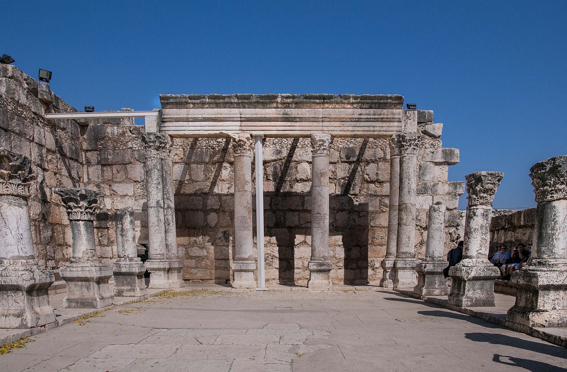 The partly reconstructed prayer hall of the white limestone synagogue at Capernaum, with Corinthian columns and a stone entablature