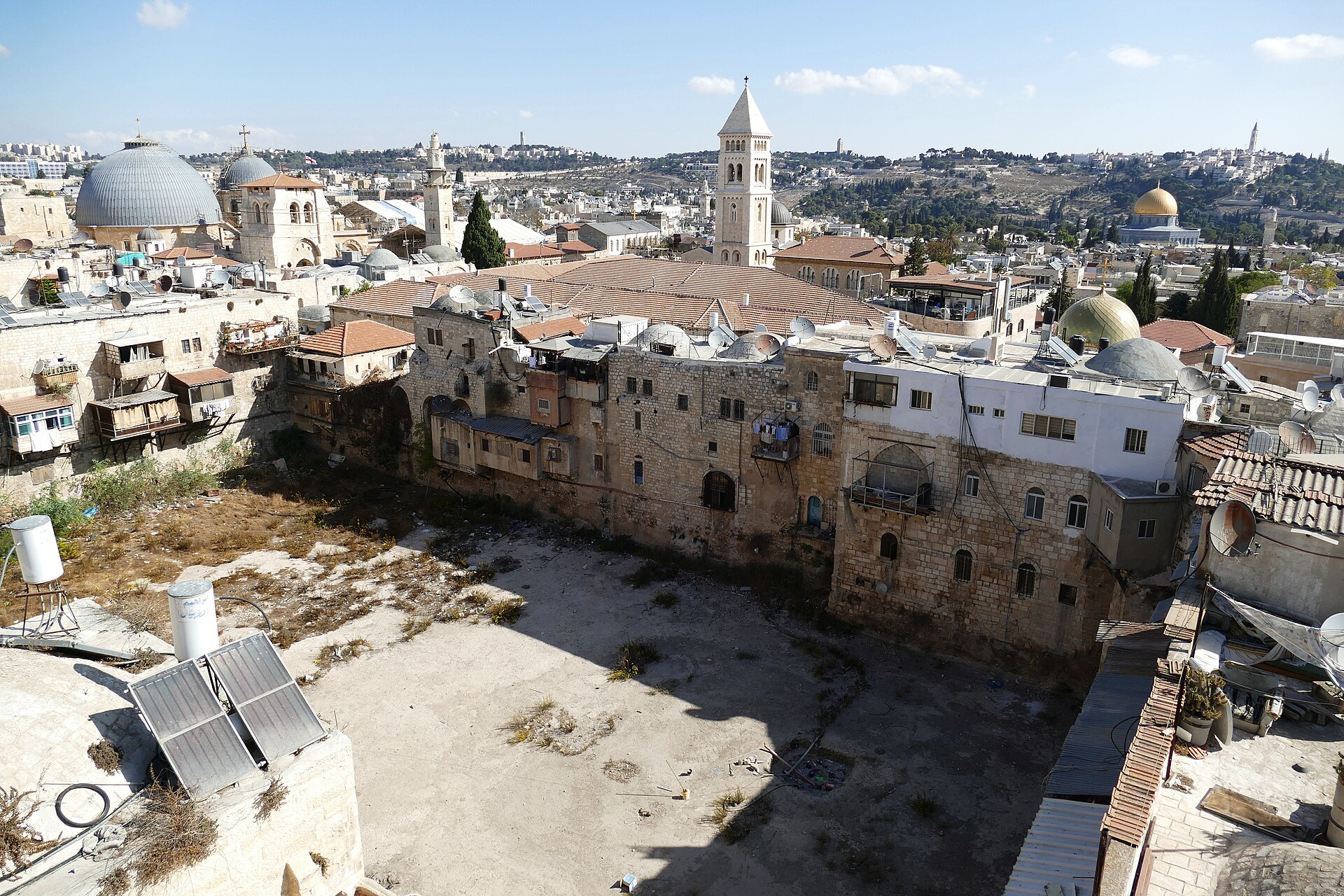 Rooftop view over Jerusalem's Old City from the Petra Hotel, across Hezekiah's Pool to the Holy Sepulchre domes, the Redeemer bell tower and the Dome of the Rock