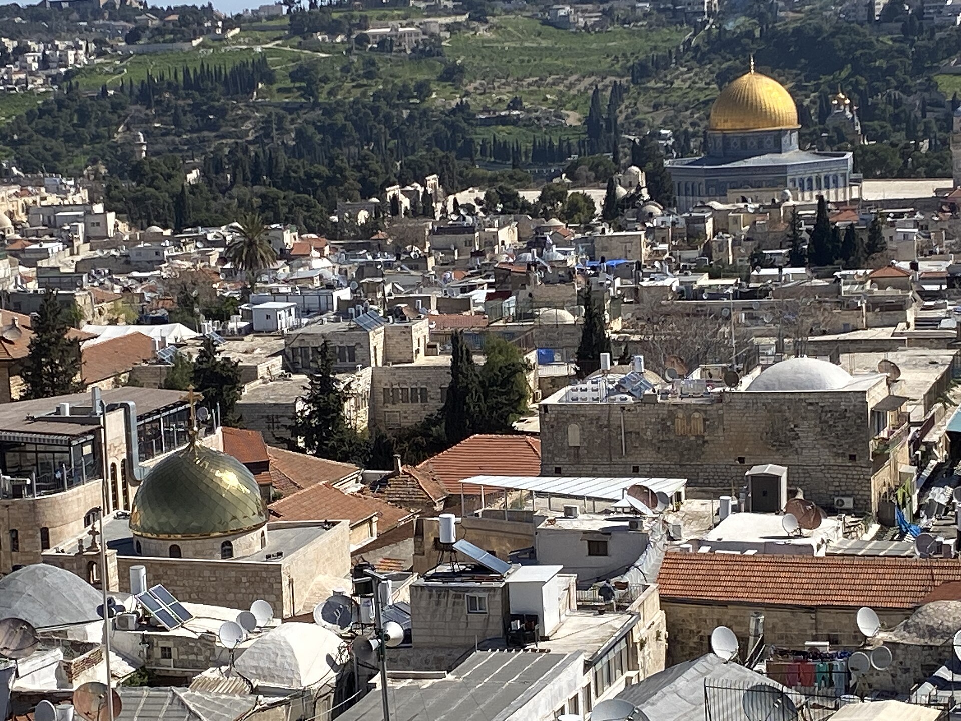 View from the top of the Tower of David over the Old City's rooftops and church domes to the golden Dome of the Rock and the Mount of Olives